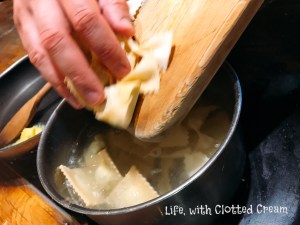 Filled pasta going into the pot