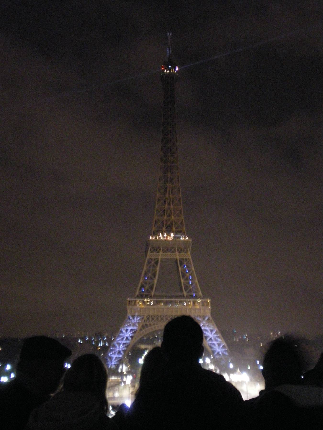 Eiffel tower in Paris at night with lights