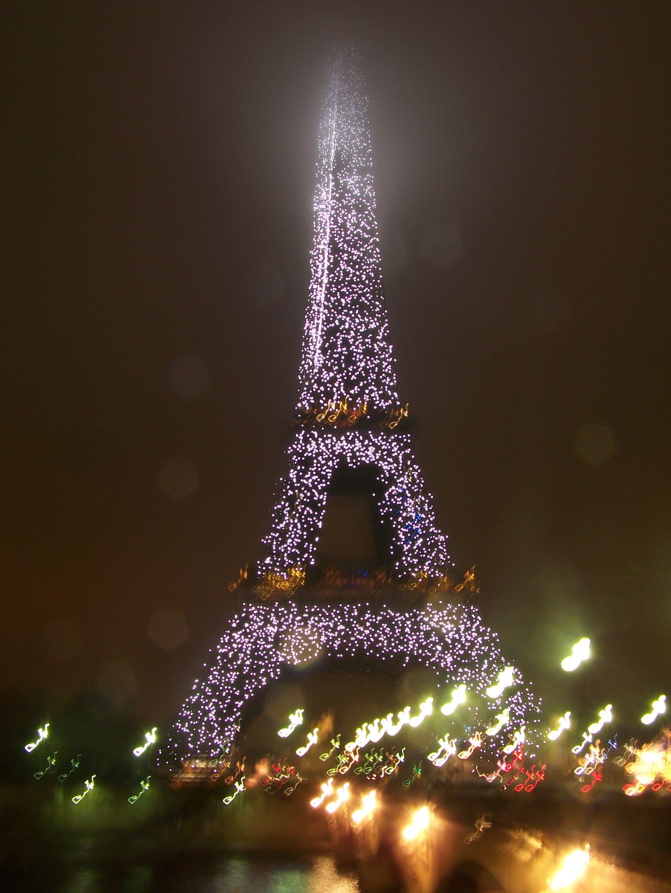 Eiffel tower in Paris at night with lights