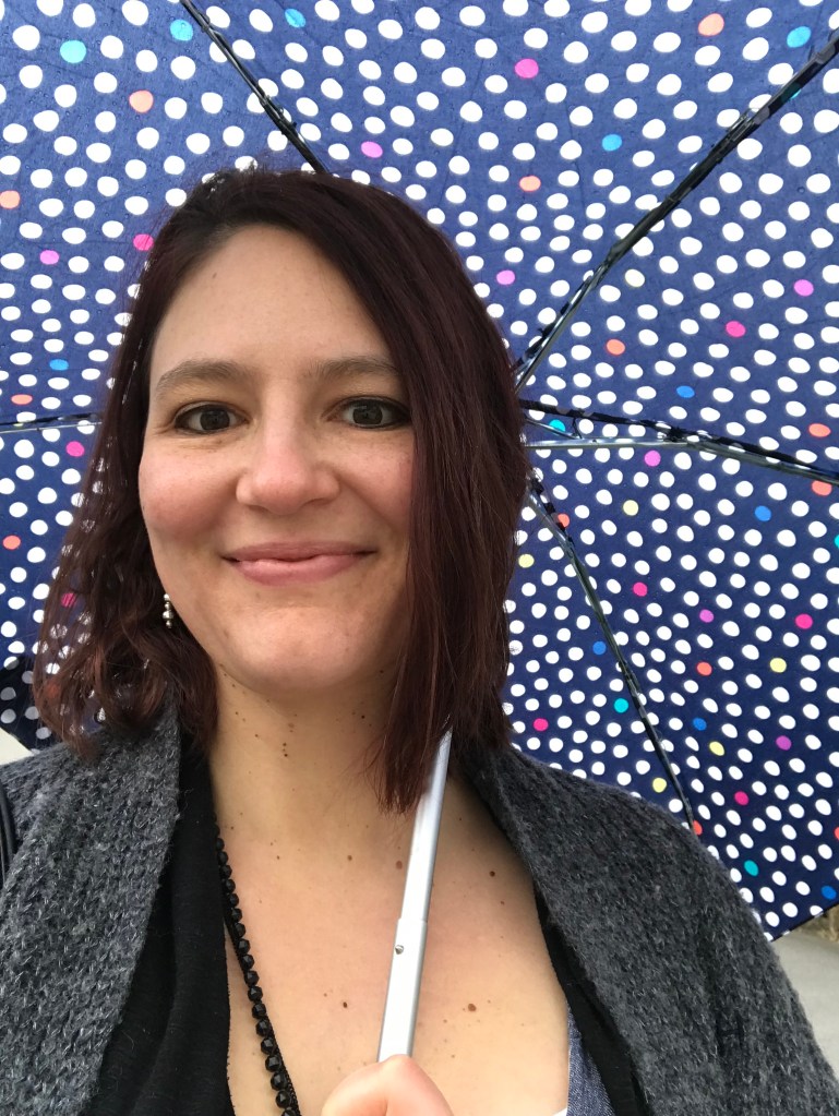 Me with my polkadot umbrella in the rain in Vienna