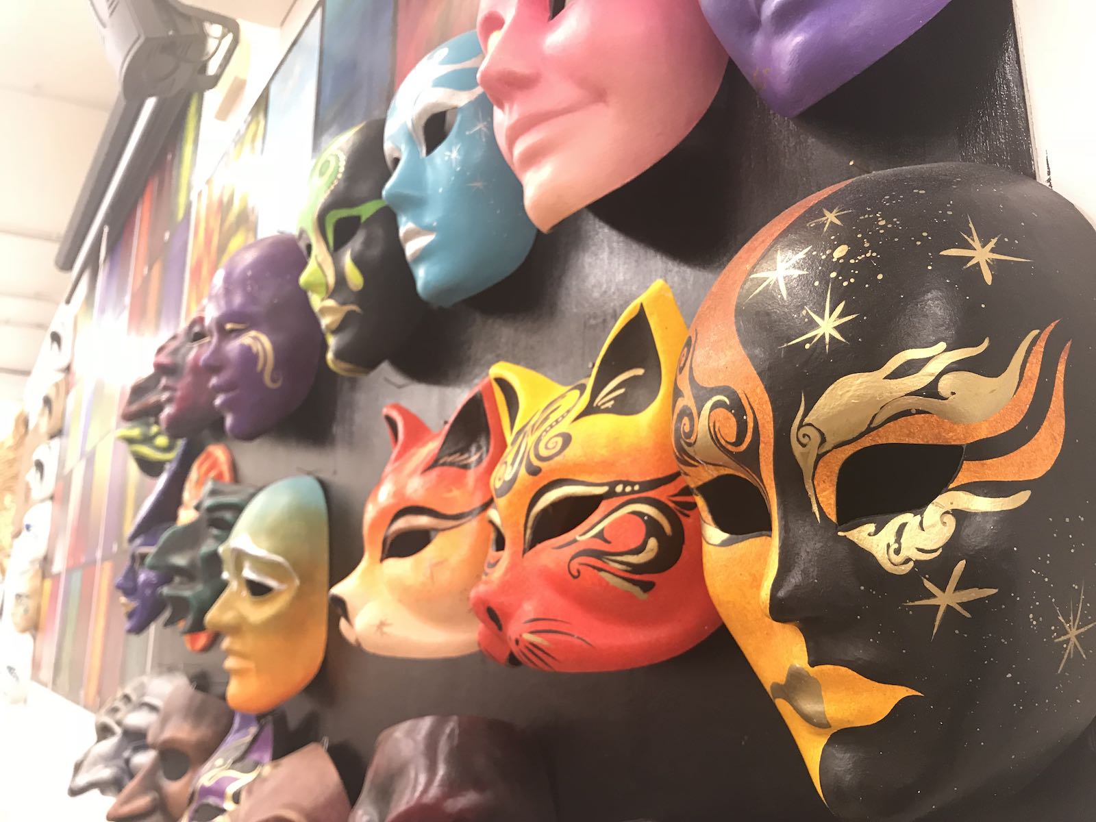 Masks on the wall at the studio