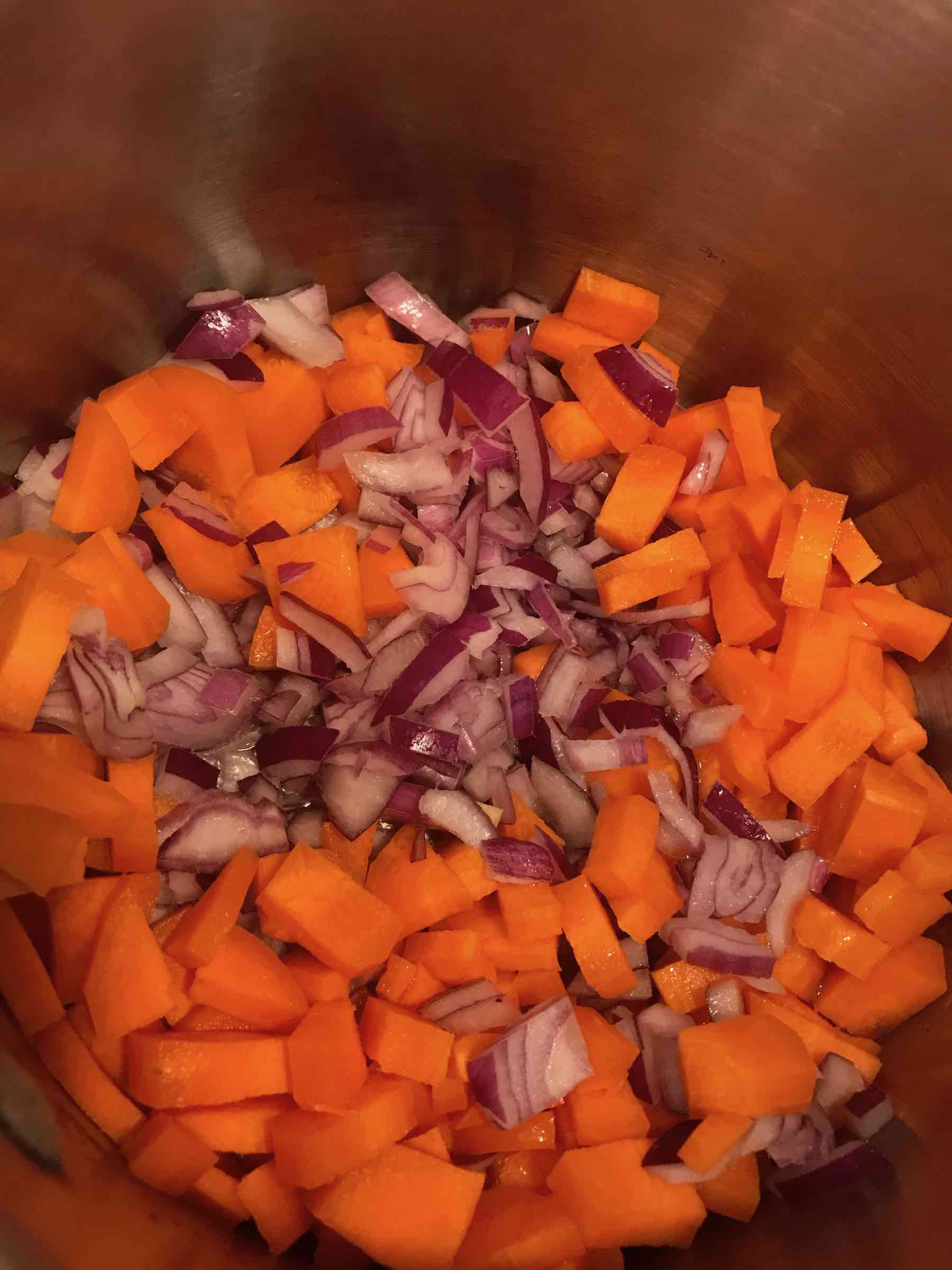 Carrots and onions in pot