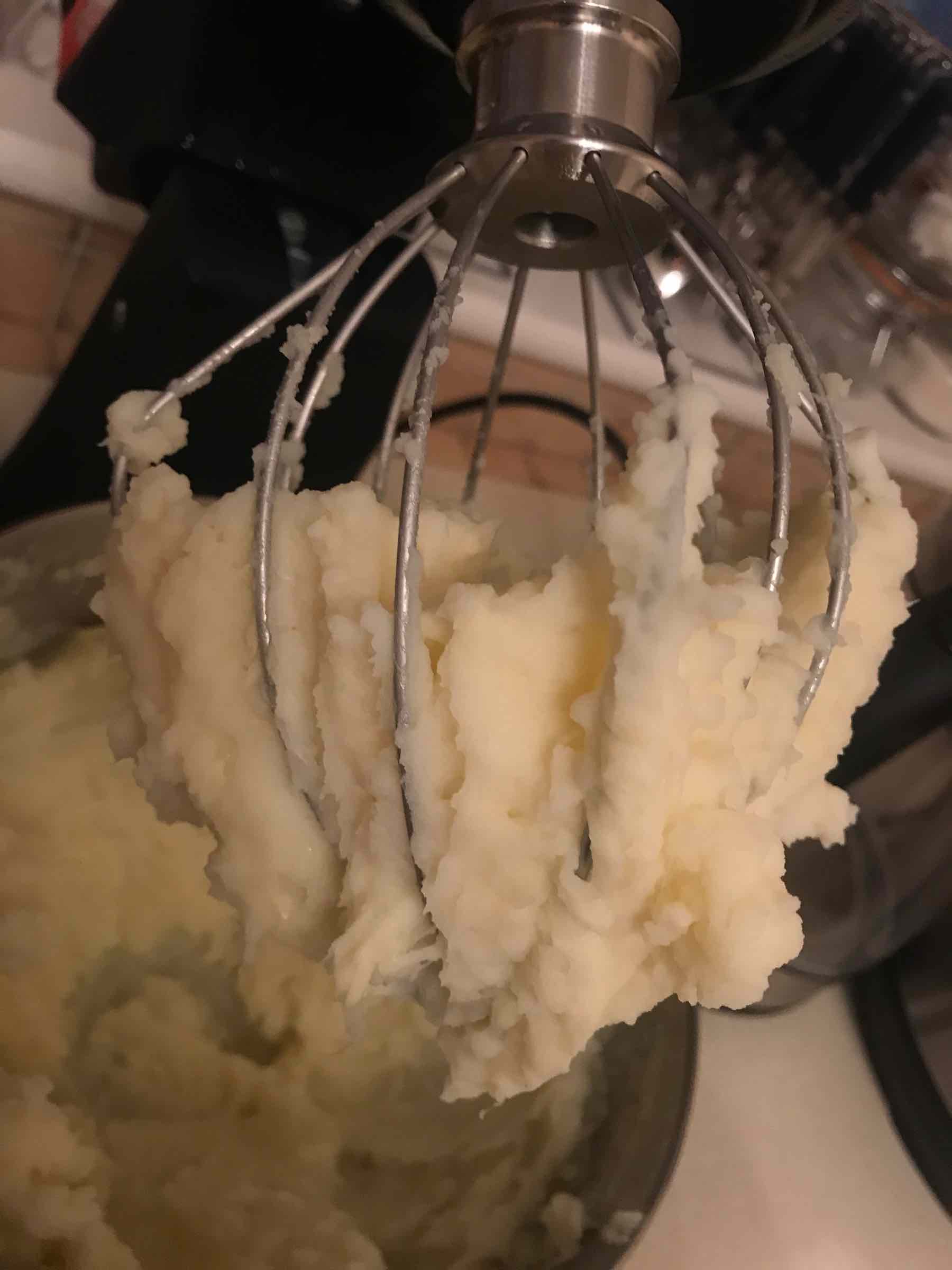 Mashed potatoes stuck to a balloon whisk