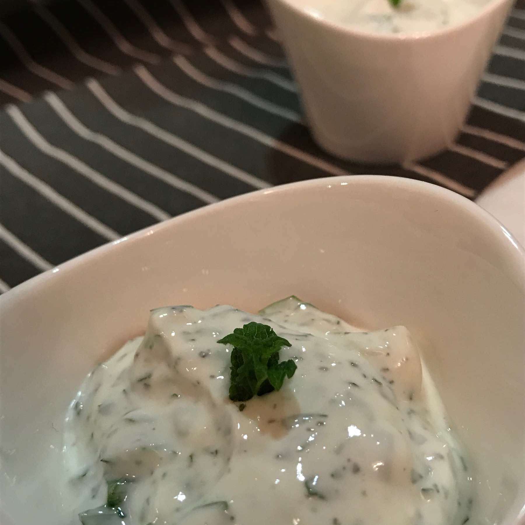 Two pots of yogurt dip