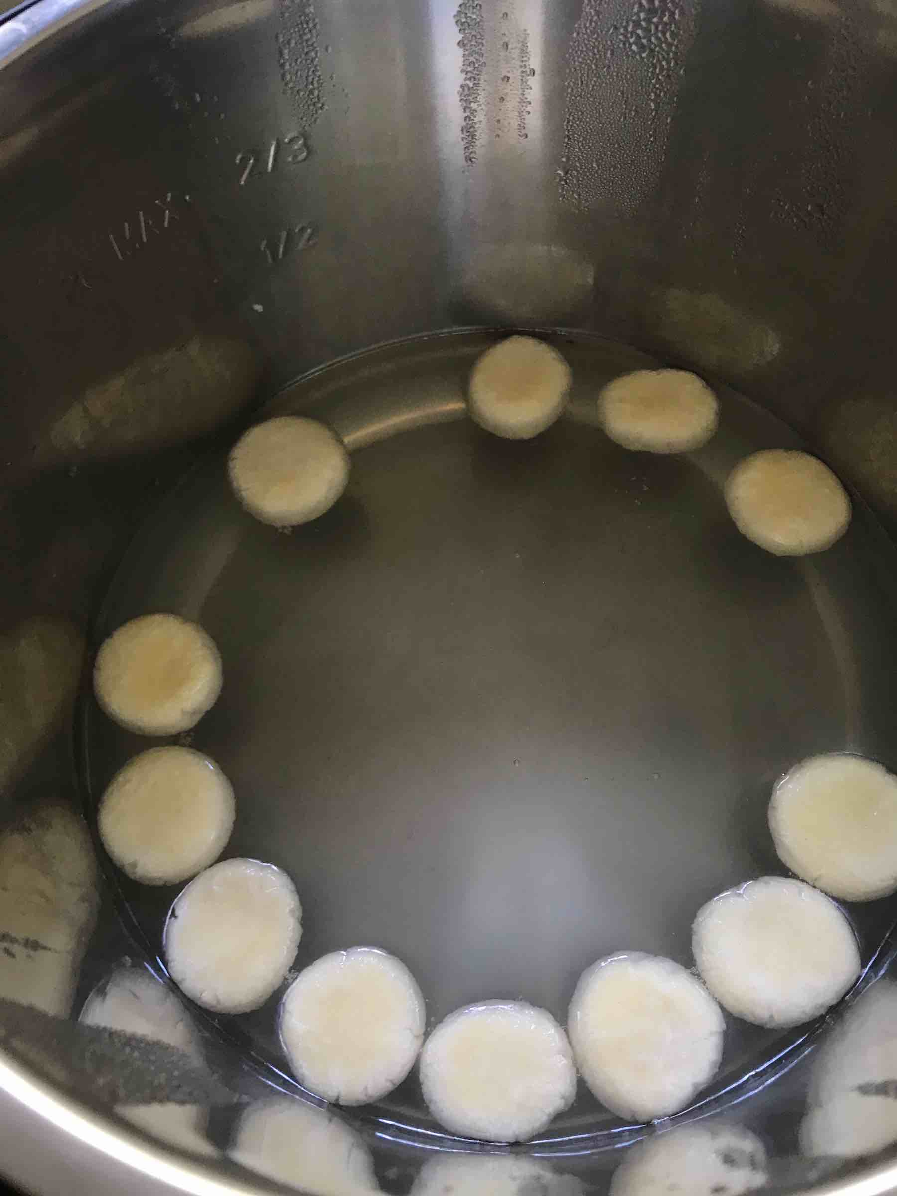 Rasmalai patties placed in sugar syrup