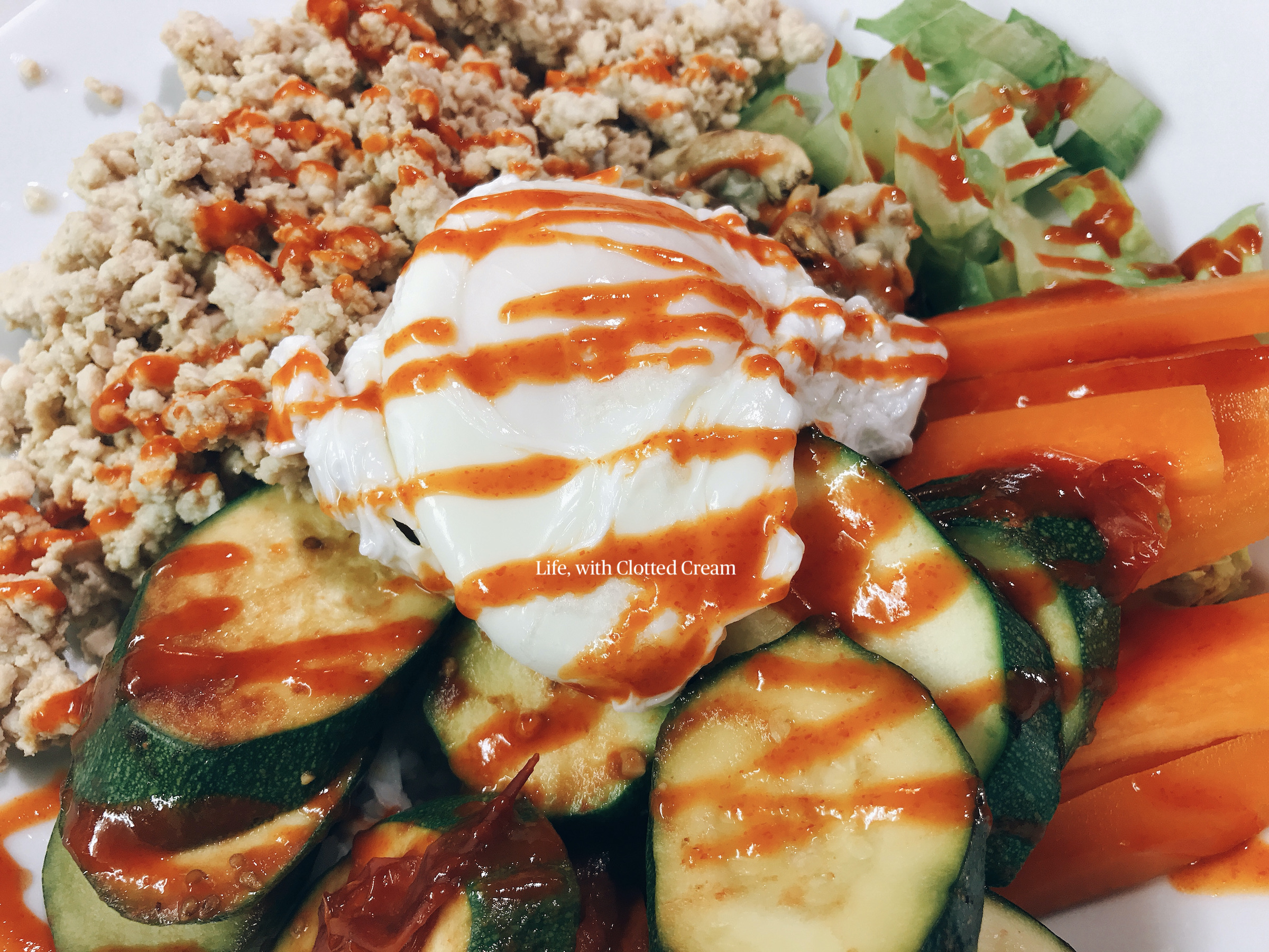 Poached egg on vegetables and turkey mince