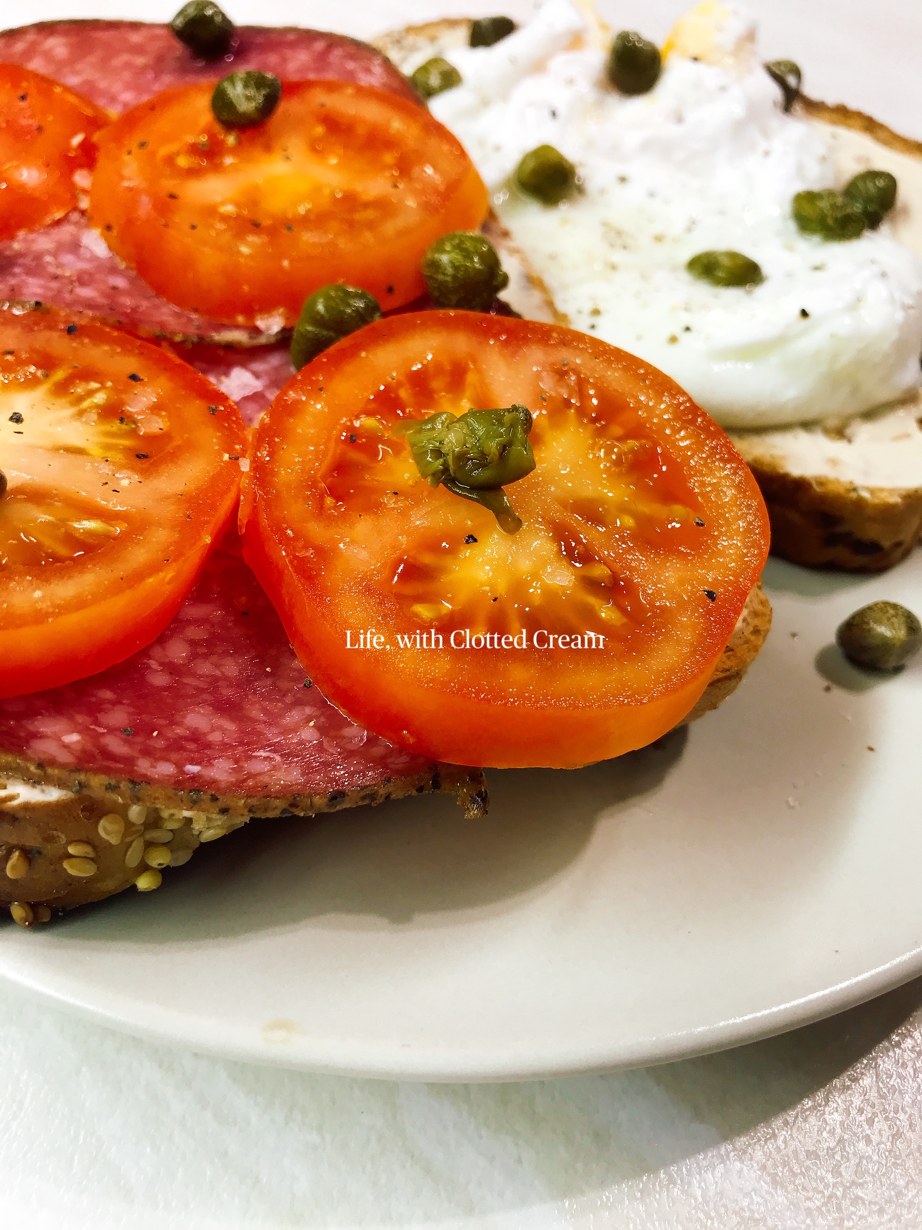 Tomato and salami sandwich with egg