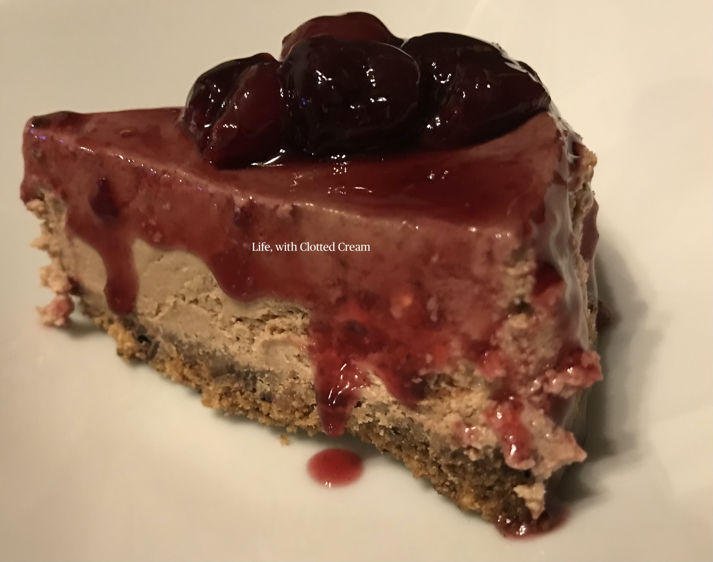 A slice of chocolate and cherry gin cheesecake