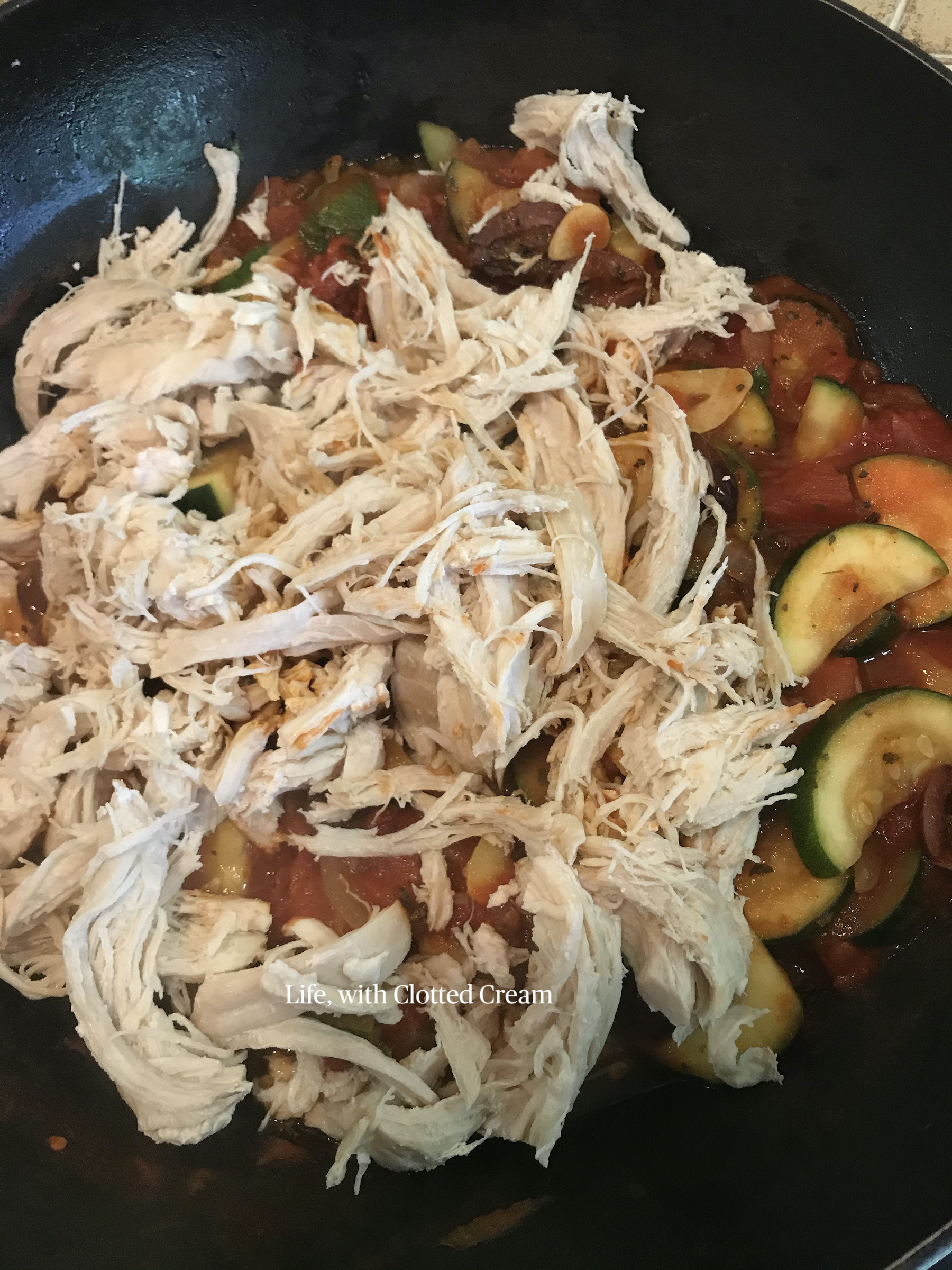 Shredded chicken in pan