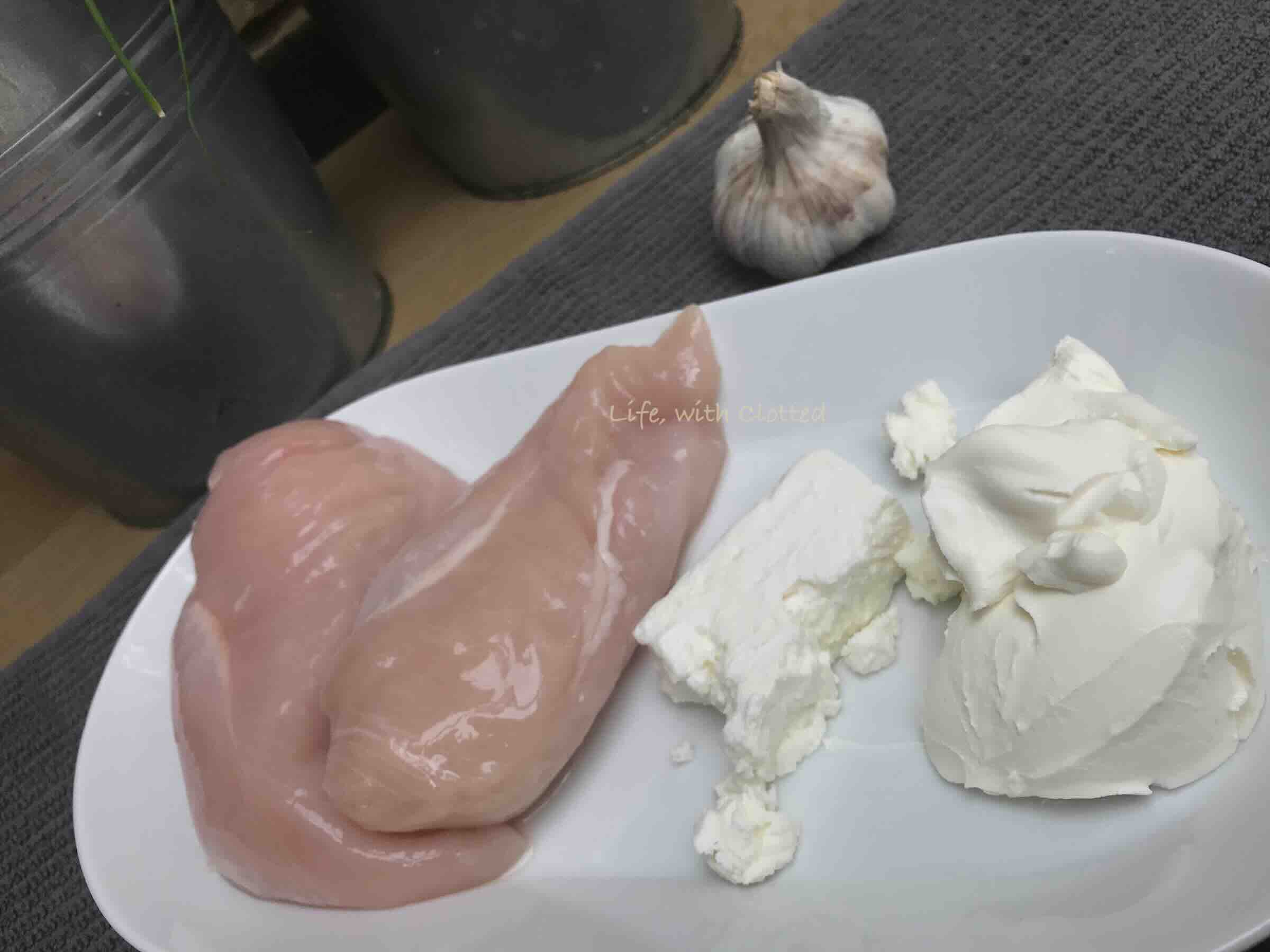 Uncooked chicken breast with cheese