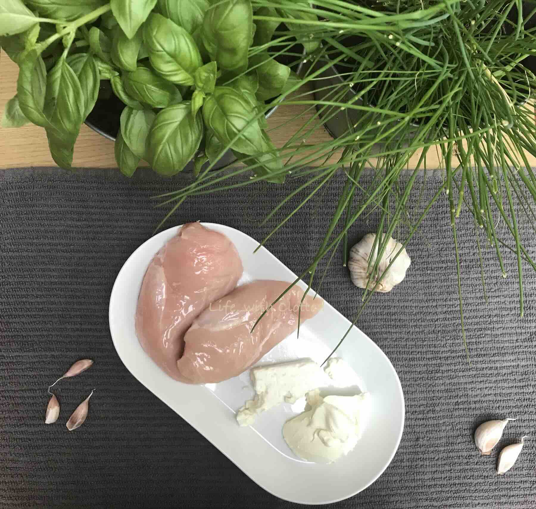 Uncooked chicken breast with garlic