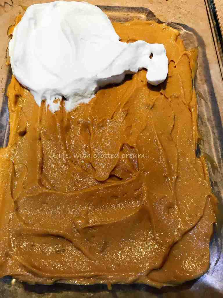 Caramel layer with a dollop of cream in the corner.