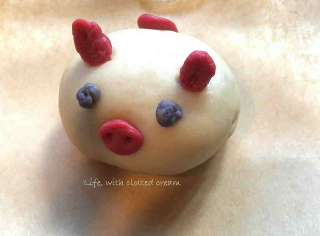 Custard filled bao decorated to look like a piglet.