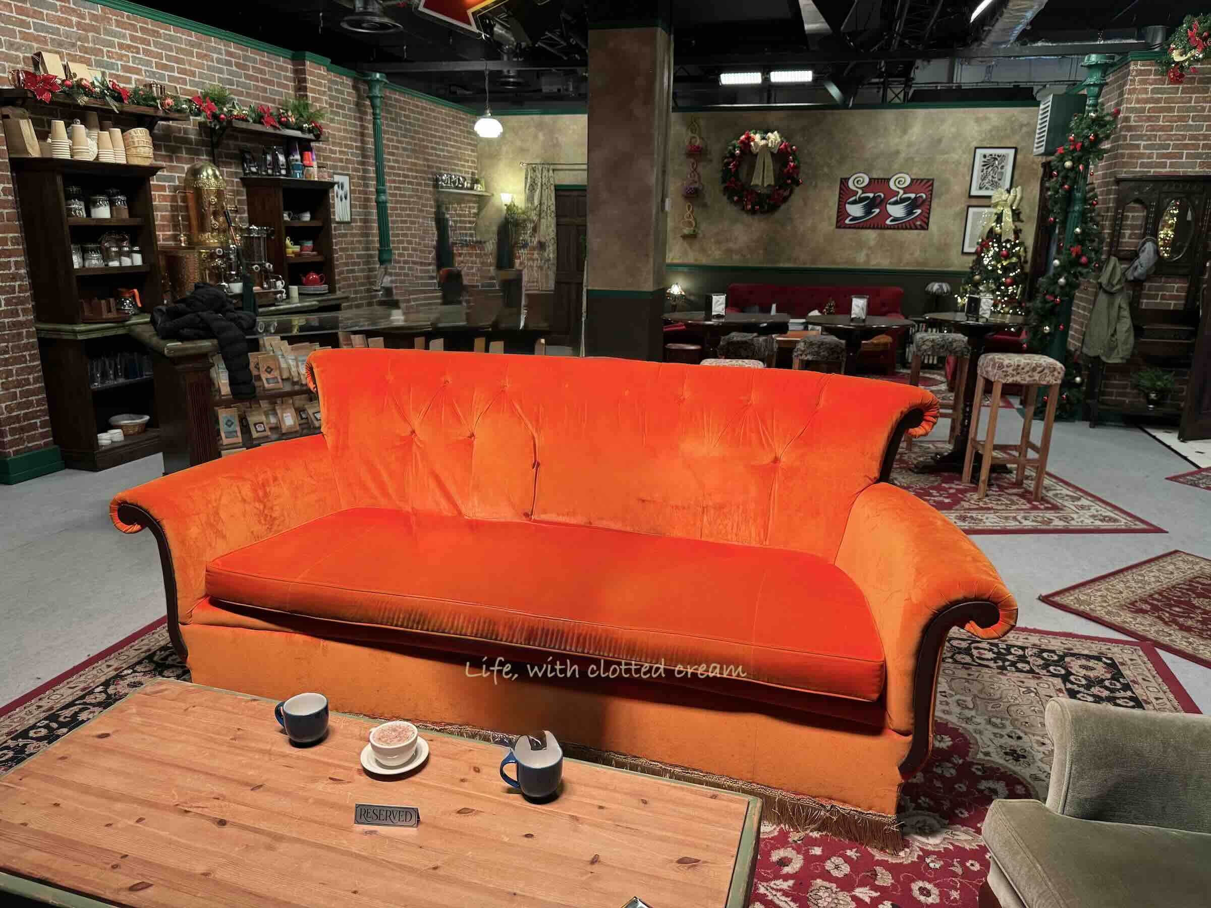 A digitally modified picture of the orange couch in Central Perk during the Friends Experience in London. I has been digitally altered to remove the people.