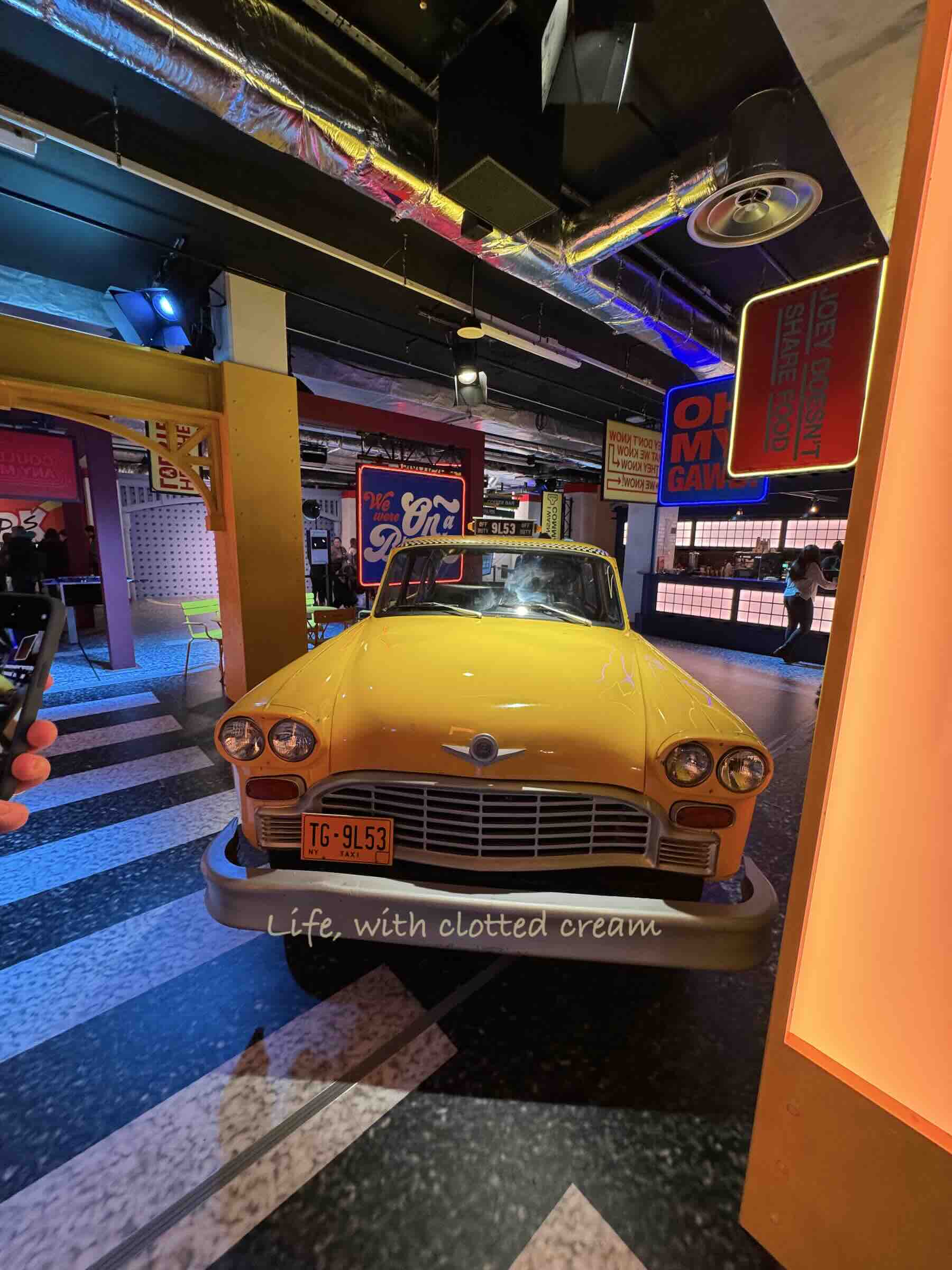 A yellow cab from New York parked in the set of Friends during the Friends experience in London